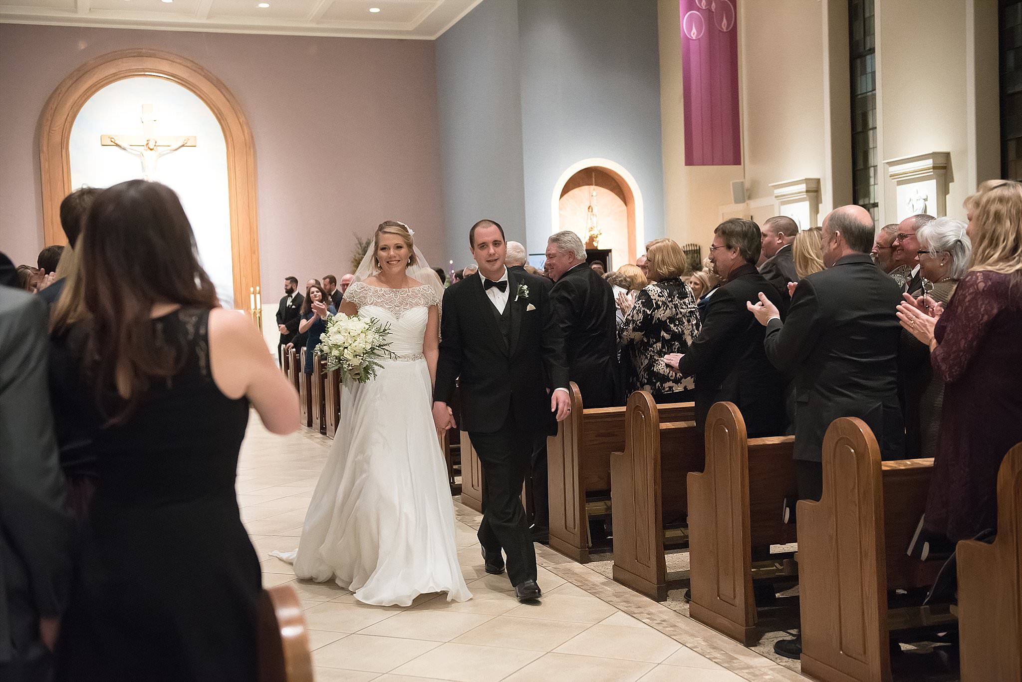 Winter Wedding at St. Mary Catholic Church  the Commodore Ballroom at Vanderbuilt University featuring an Alpha Delta Pi bride and Phi Delta Theta groom. Photography by Ivory Door Studio